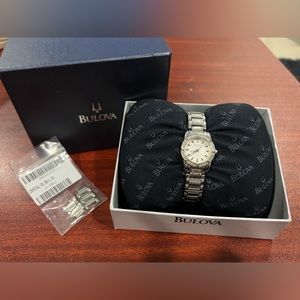 Bulova watch with white face and crystals 2012